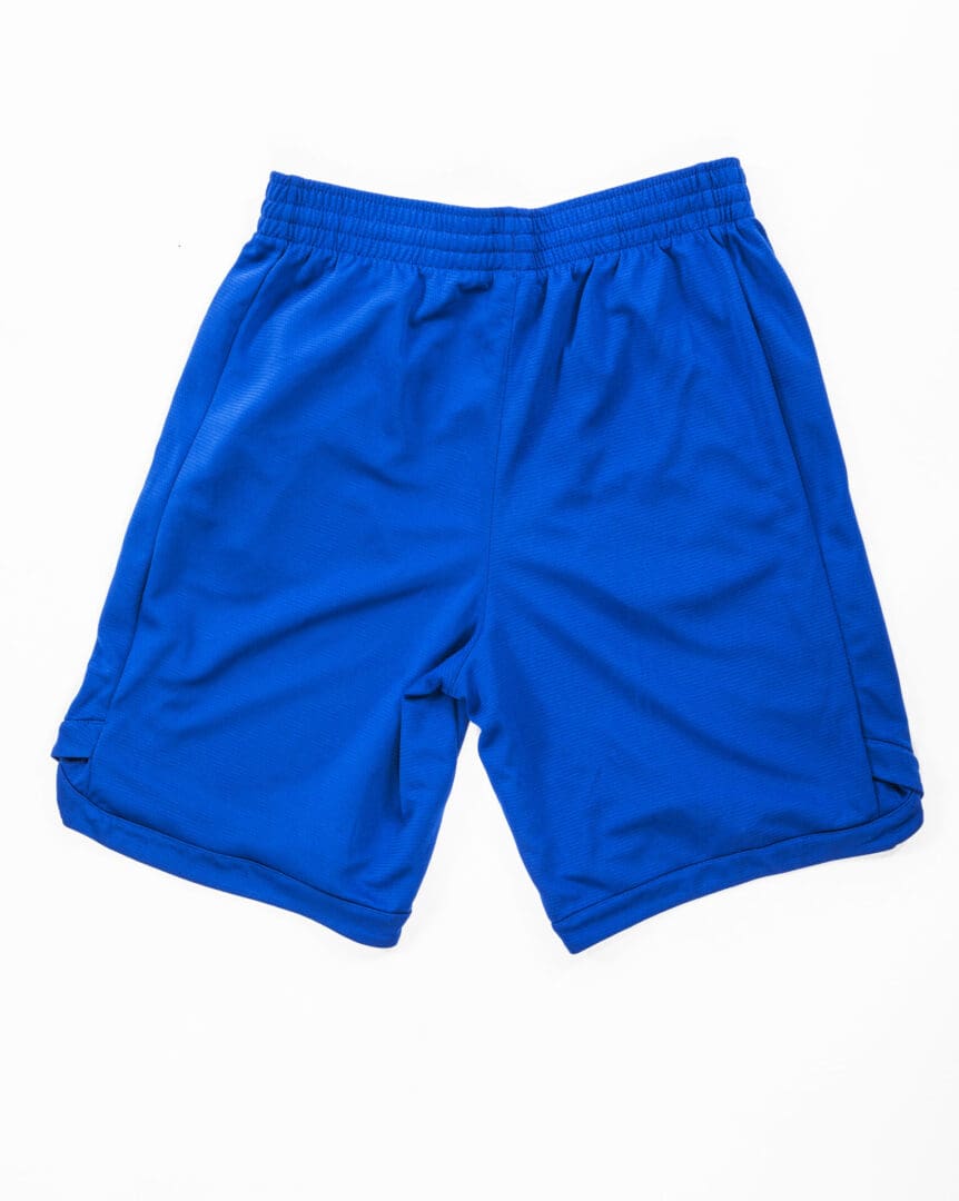 Blue athletic shorts on white background.