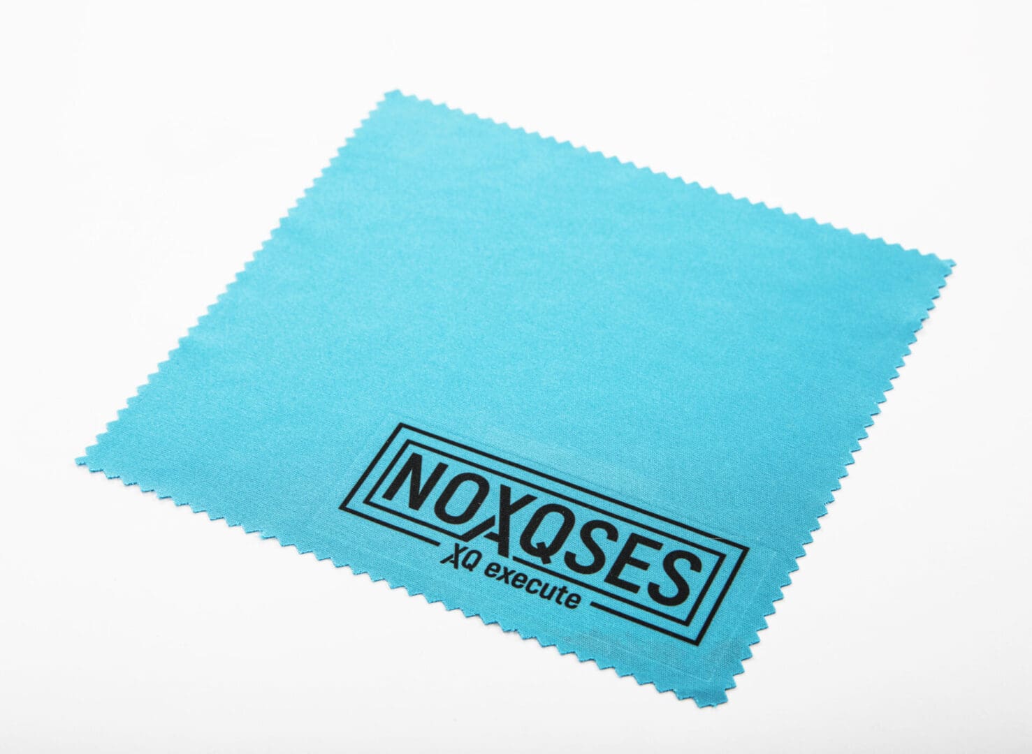 Blue cleaning cloth with "NOXQSES" logo.
