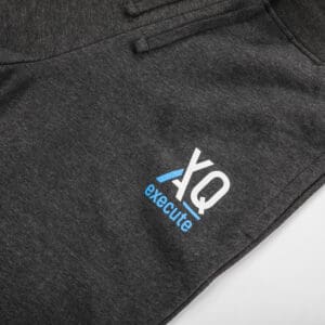 Dark gray sweatpants with "XQ execute" logo.