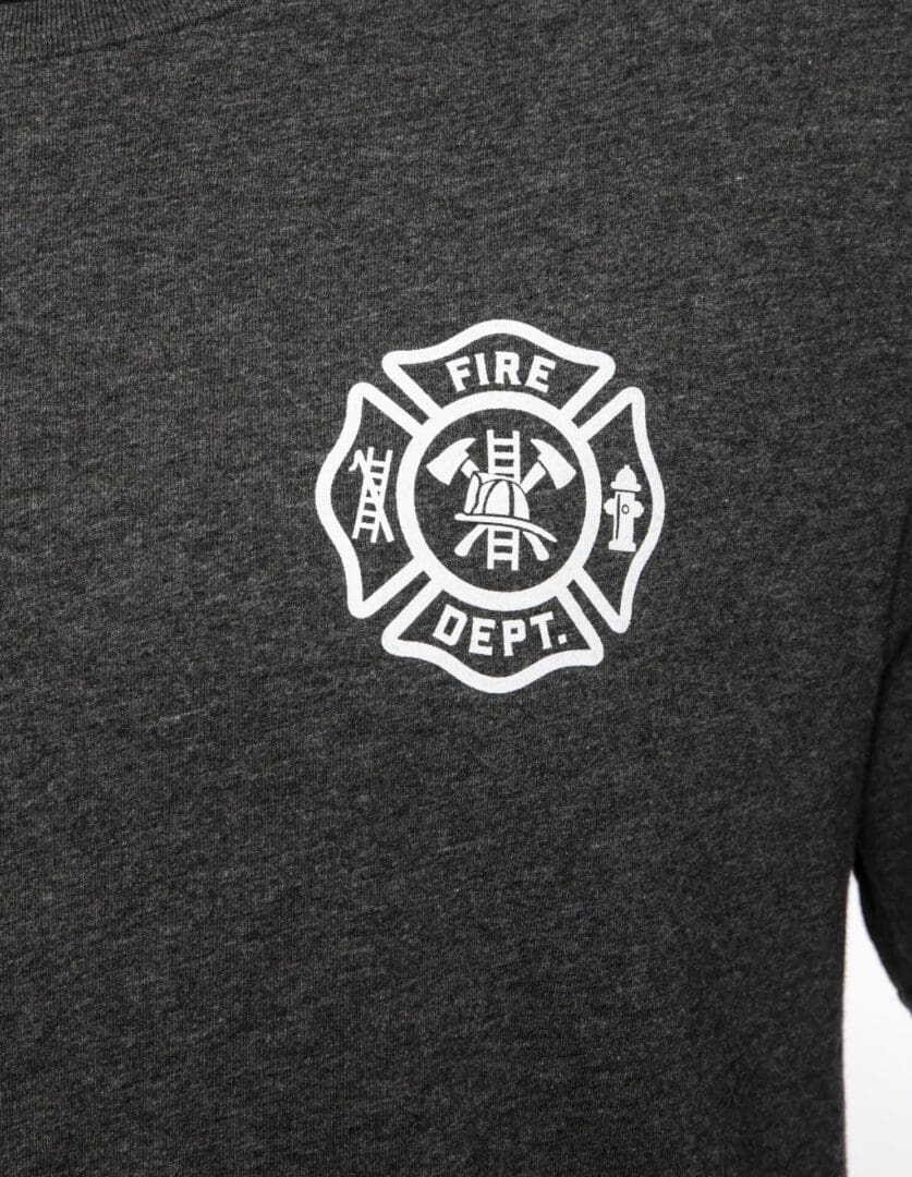 Fire department emblem on dark fabric shirt.