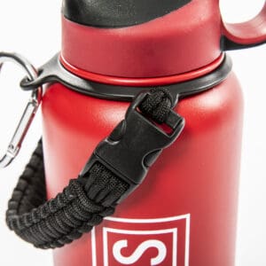 Red water bottle with carabiner and strap.